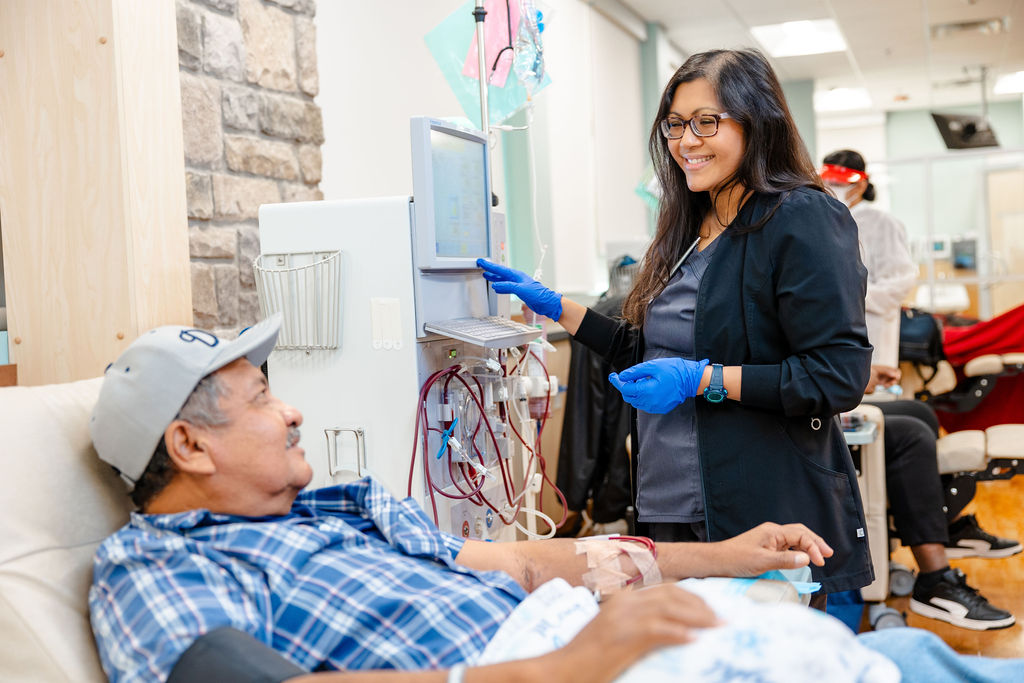 Nurse with patient inside clinic.